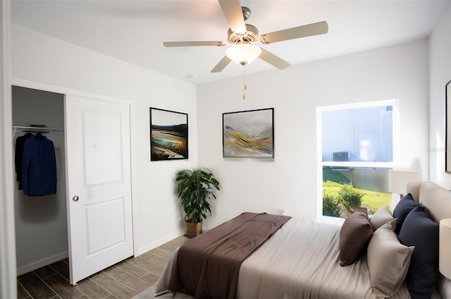 25434 Colon Dr, Punta Gorda, FL 33983 - bedroom featuring wood tiled floors, a closet, a ceiling fan, and baseboards