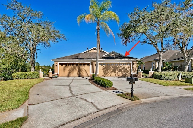 ranch-style home featuring a garage