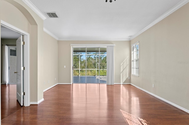 unfurnished room with crown molding and dark wood-type flooring