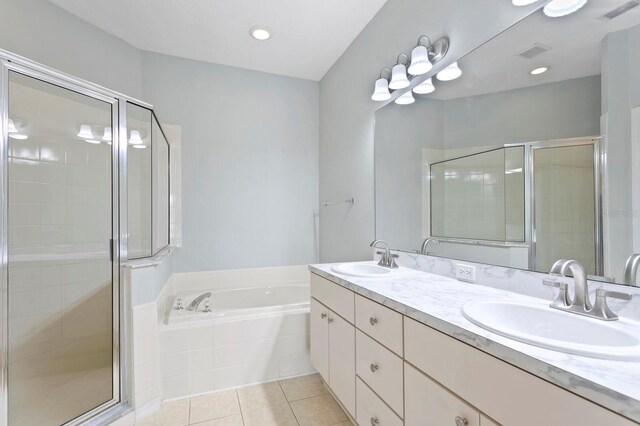 bathroom featuring tile patterned flooring, vanity, and independent shower and bath