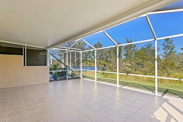 view of patio featuring glass enclosure