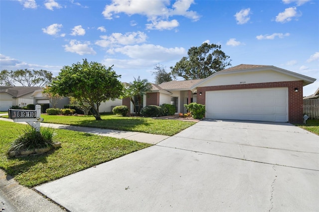 single story home with a garage and a front yard