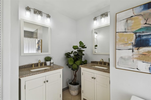 bathroom with tile patterned flooring and vanity