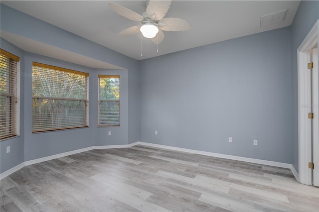 spare room with ceiling fan and light hardwood / wood-style floors