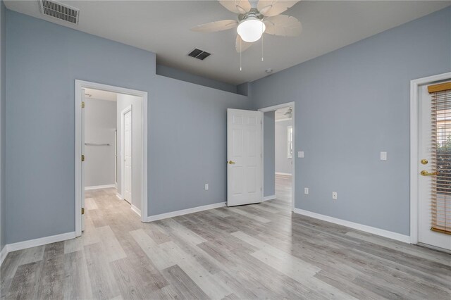 unfurnished bedroom featuring ceiling fan and light hardwood / wood-style flooring