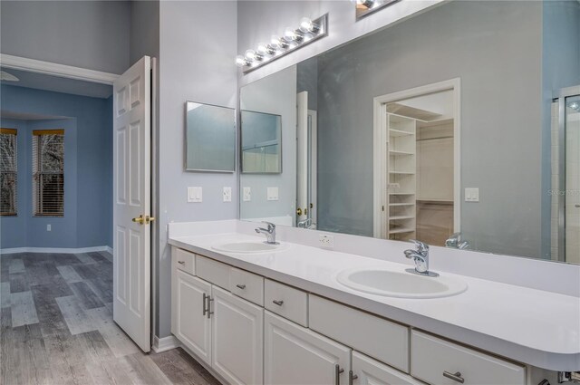 bathroom with vanity and hardwood / wood-style flooring