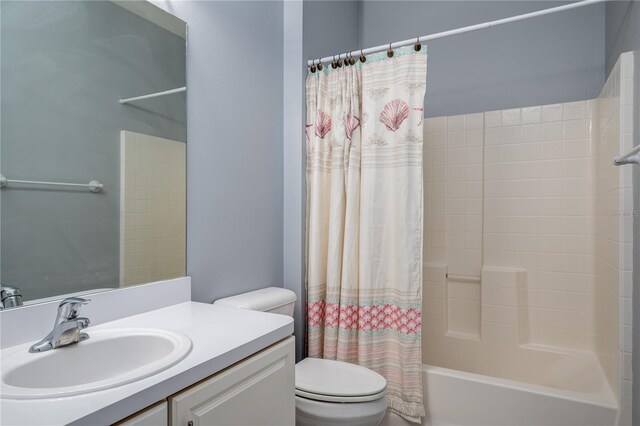 full bathroom with shower / bath combination with curtain, toilet, and vanity