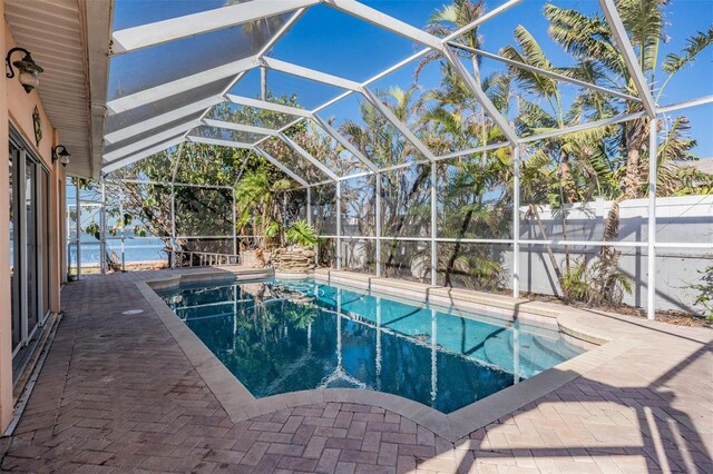 view of pool featuring a lanai and a patio area