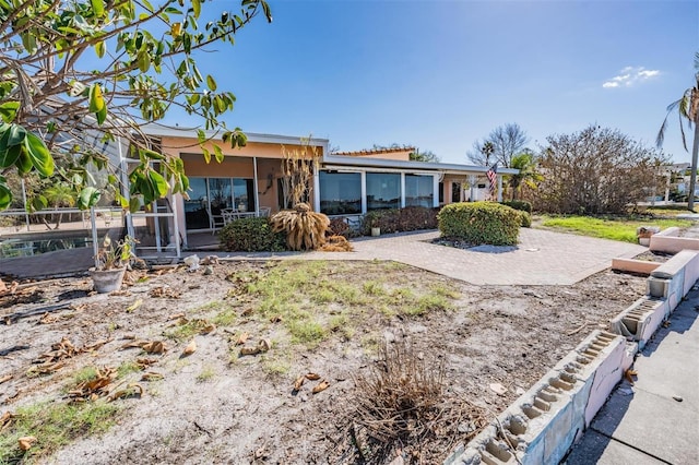 view of front of home with a patio area