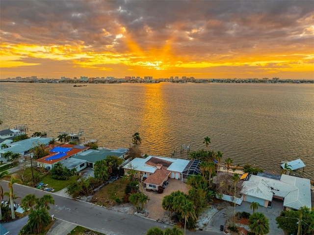 aerial view at dusk with a water view