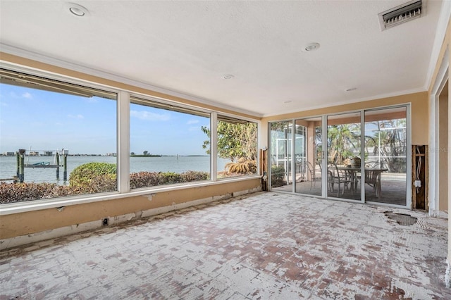 unfurnished sunroom with a water view and a wealth of natural light