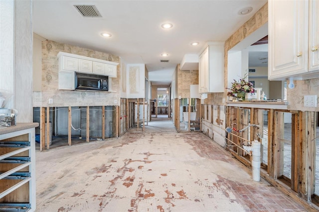 kitchen featuring white cabinets