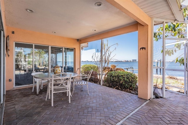 view of patio / terrace with a water view