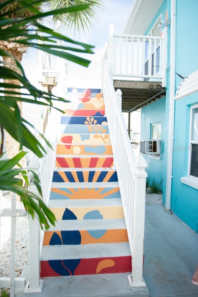 staircase featuring cooling unit