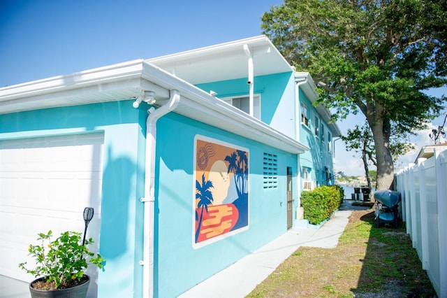 view of property exterior with a garage