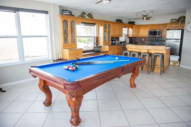 playroom featuring light tile patterned floors, ceiling fan, and billiards