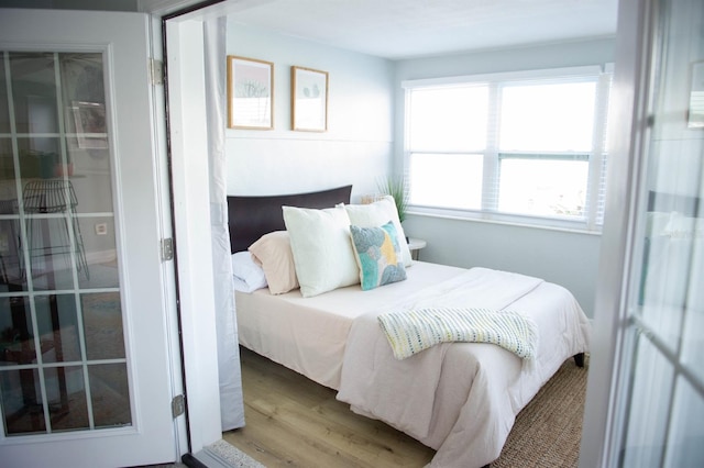 bedroom featuring wood-type flooring