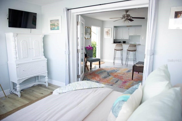 bedroom with light wood-type flooring and ceiling fan