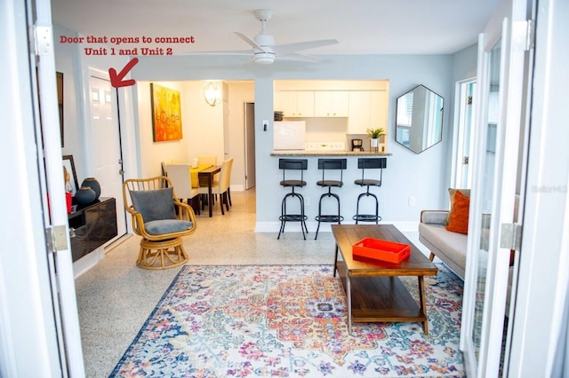 living room featuring ceiling fan