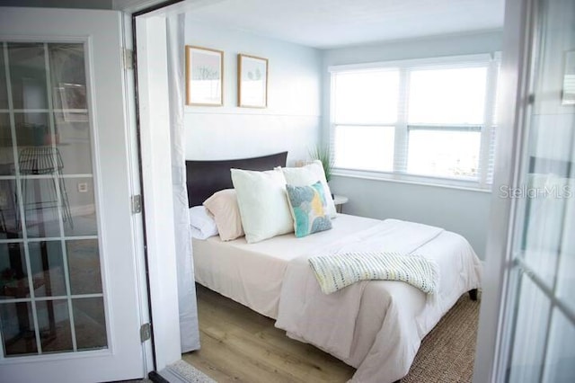 bedroom with wood-type flooring