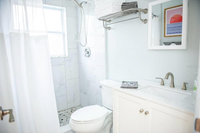 bathroom featuring curtained shower, vanity, a healthy amount of sunlight, and toilet