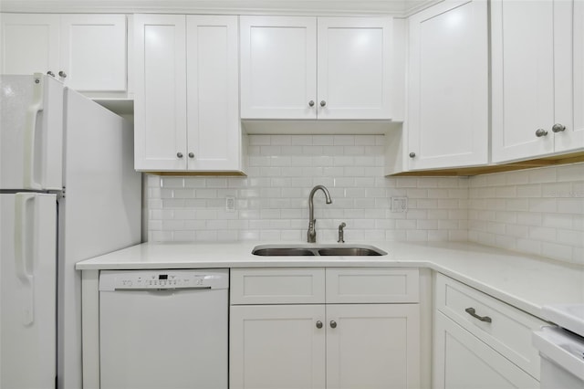 kitchen with backsplash, white cabinetry, white appliances, and sink