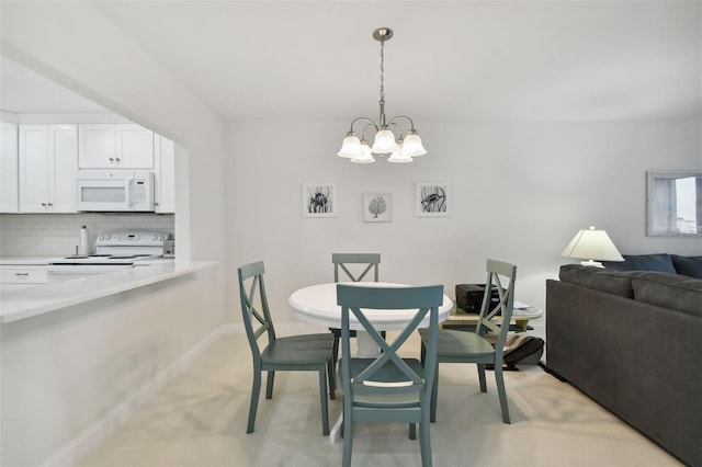 dining area featuring a chandelier