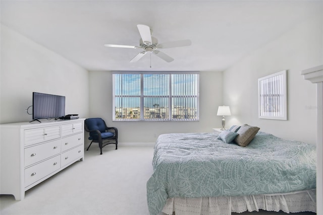 bedroom featuring light colored carpet and ceiling fan