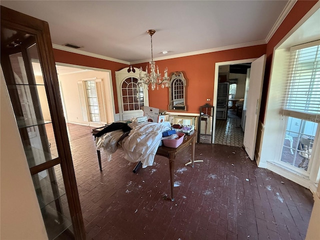 dining room featuring dark hardwood / wood-style flooring, crown molding, and an inviting chandelier