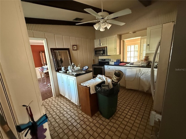 kitchen featuring beam ceiling, white cabinetry, electric range, ceiling fan, and light tile patterned floors