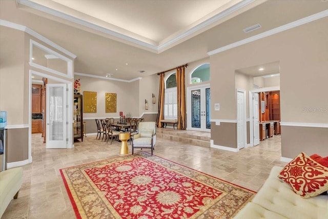 interior space with crown molding and french doors