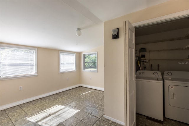 washroom featuring washer and clothes dryer