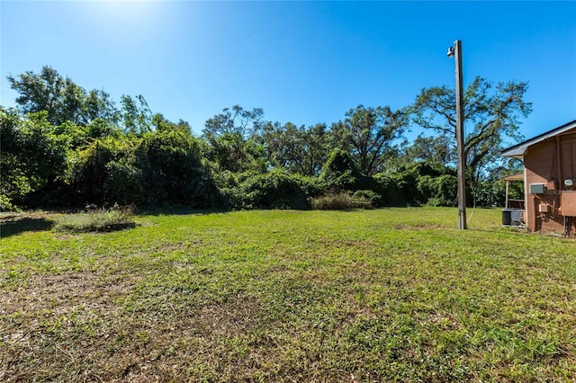 view of yard featuring central AC