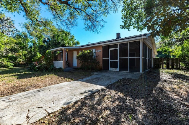 view of front of house featuring a sunroom