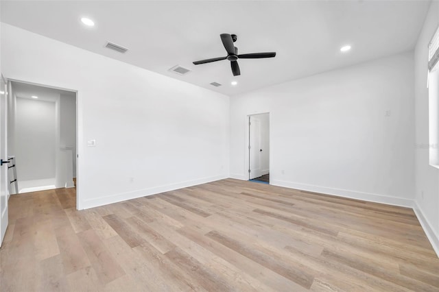 empty room featuring ceiling fan and light hardwood / wood-style floors