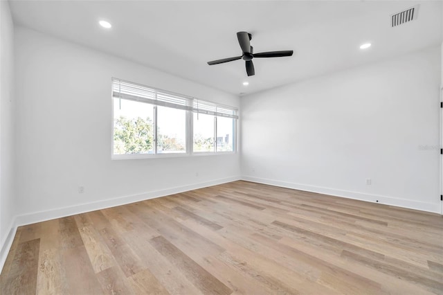 unfurnished room featuring ceiling fan and light hardwood / wood-style flooring