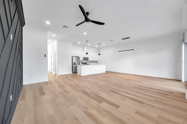 unfurnished living room featuring ceiling fan, light wood-type flooring, and ornamental molding