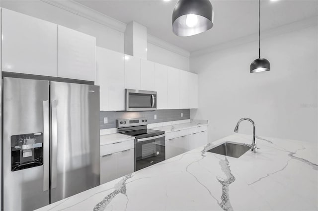 kitchen featuring light stone counters, decorative light fixtures, and stainless steel appliances