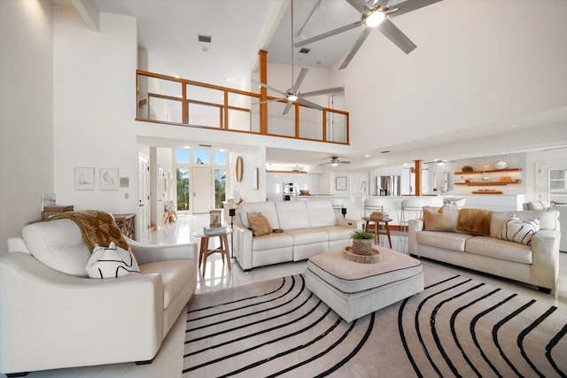 living room featuring high vaulted ceiling and ceiling fan