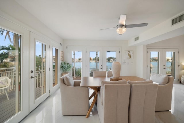 18 Winston Dr, Belleair, FL 33756 - dining room with french doors, a water view, and ceiling fan