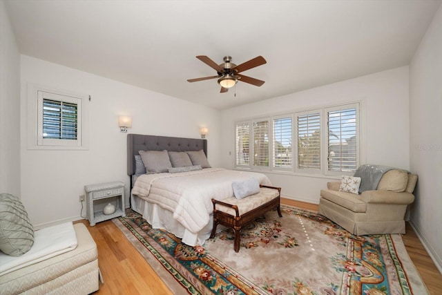 bedroom featuring hardwood / wood-style floors and ceiling fan