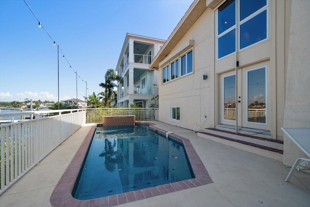18 Winston Dr, Belleair, FL 33756 - view of swimming pool with french doors