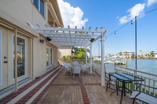 18 Winston Dr, Belleair, FL 33756 - view of patio with a water view, a pergola, and outdoor dining area