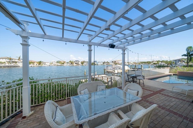 view of patio / terrace featuring a boat dock, a pergola, a water view, and a fenced in pool