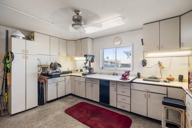 18 Winston Dr, Belleair, FL 33756 - kitchen with ceiling fan, dark speckled floor, a textured ceiling, freestanding refrigerator, and light countertops