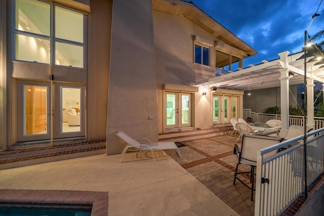 view of patio / terrace featuring a pergola and french doors