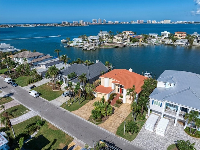 birds eye view of property with a water view