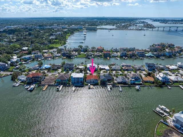 birds eye view of property featuring a water view