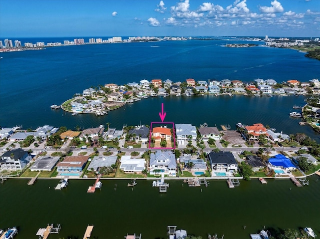 birds eye view of property featuring a water view