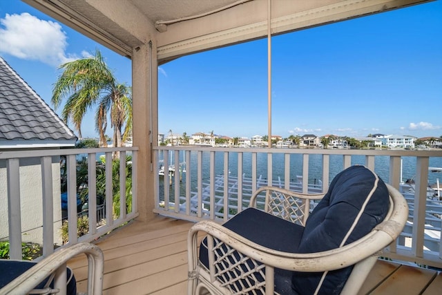 balcony featuring a water view